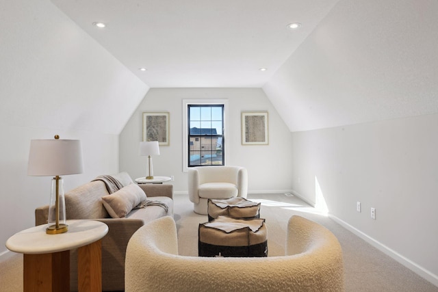 living area featuring lofted ceiling and carpet flooring