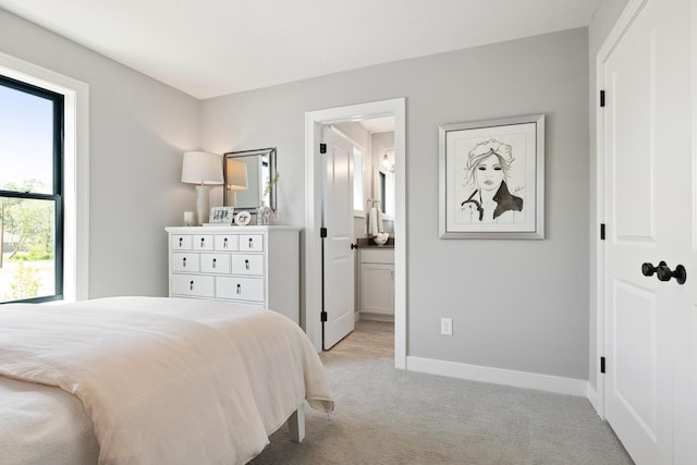 carpeted bedroom with ensuite bathroom