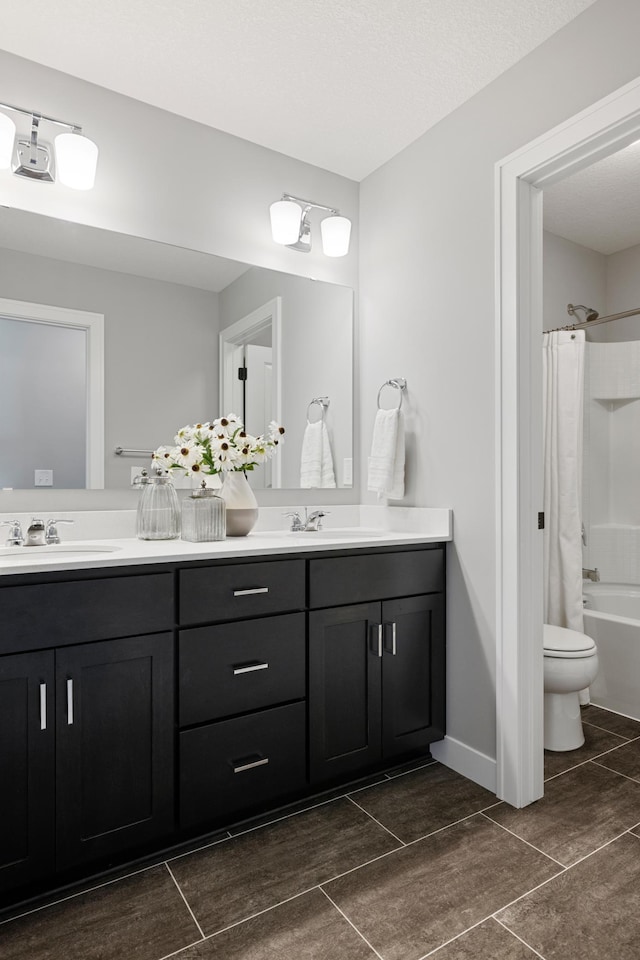 full bathroom with toilet, tile patterned flooring, shower / tub combo, and double vanity