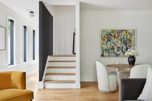 dining space with light hardwood / wood-style floors