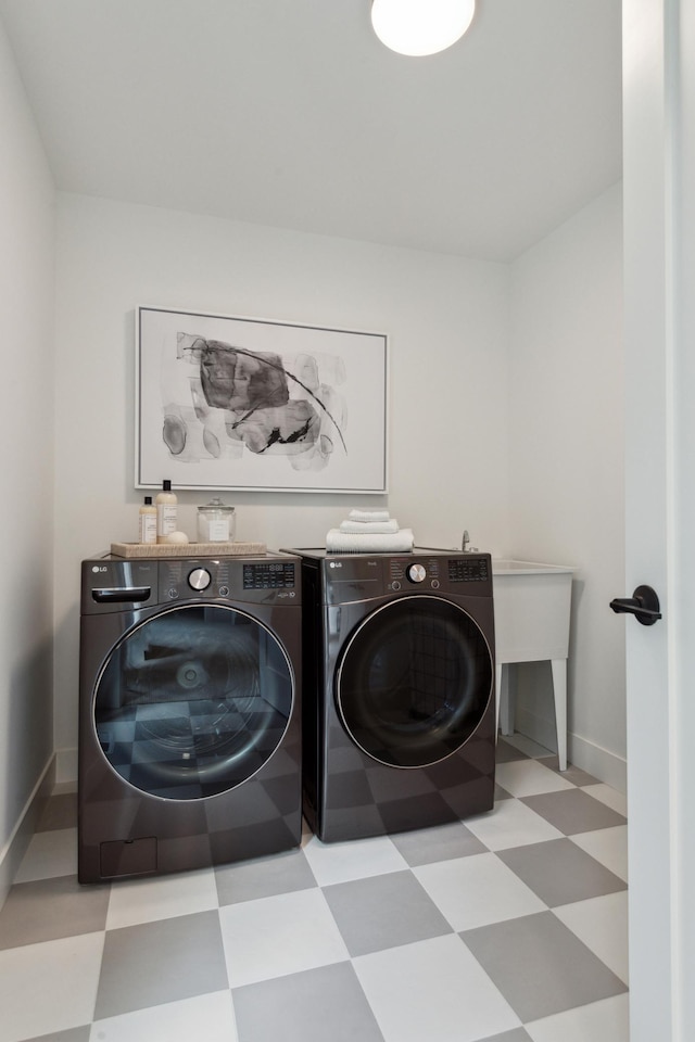 laundry area featuring washing machine and clothes dryer