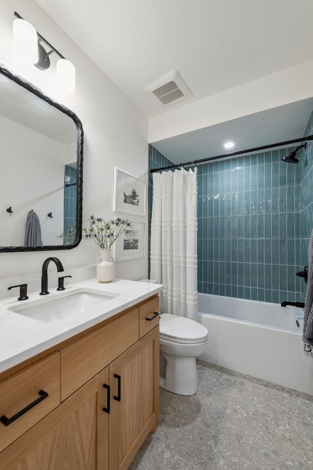 full bathroom with vanity, toilet, and shower / tub combo