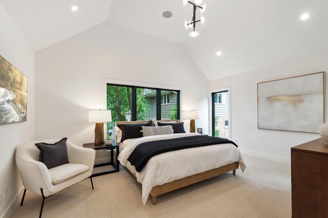 bedroom with light carpet and high vaulted ceiling