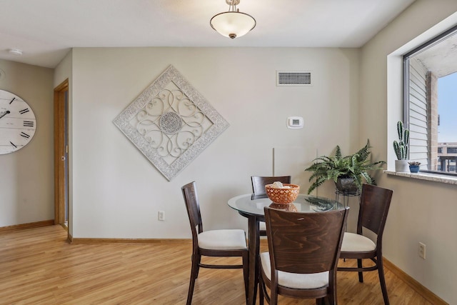 dining room with light wood-type flooring