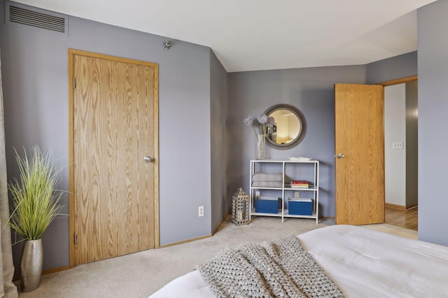 bedroom with light colored carpet