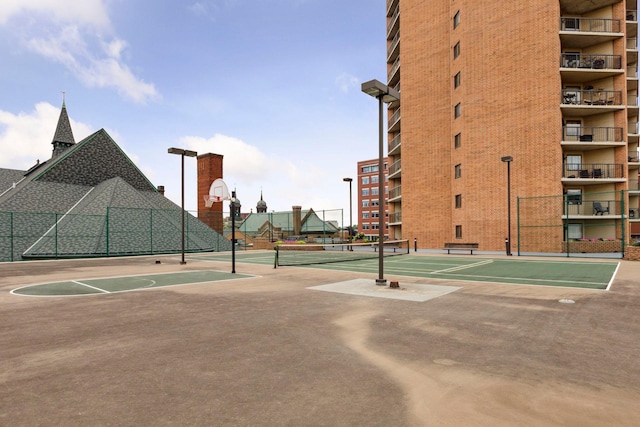 view of tennis court featuring basketball court