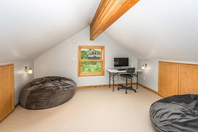 office space featuring lofted ceiling with beams and light carpet