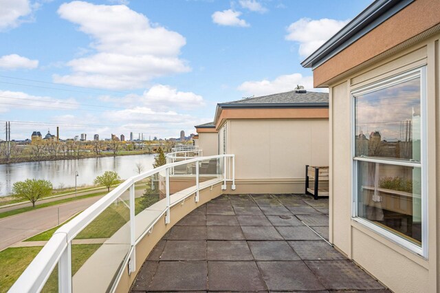 balcony featuring a water view