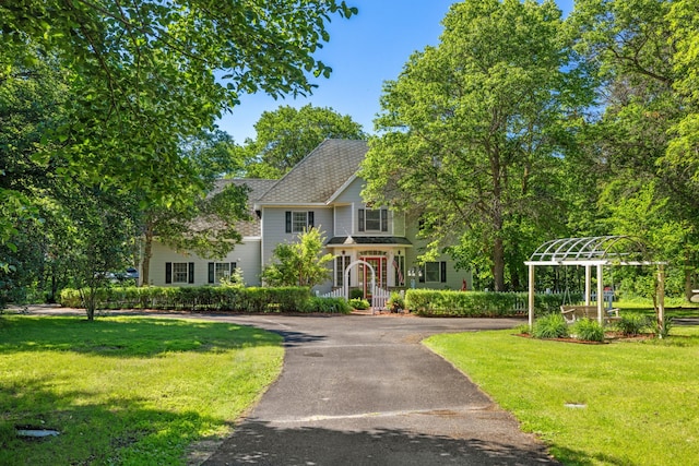 39050 Twin Lakes Rd, Menahga, MN 56464 - view of front facade with roof with shingles, a front yard, and aphalt driveway