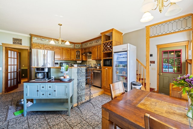 kitchen with stainless steel appliances, an inviting chandelier, pendant lighting, tile patterned floors, and ornamental molding