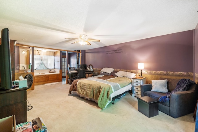 bedroom with carpet, a textured ceiling, and ceiling fan