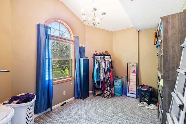 39050 Twin Lakes Rd, Menahga, MN 56464 - spacious closet with a notable chandelier, carpet, and vaulted ceiling