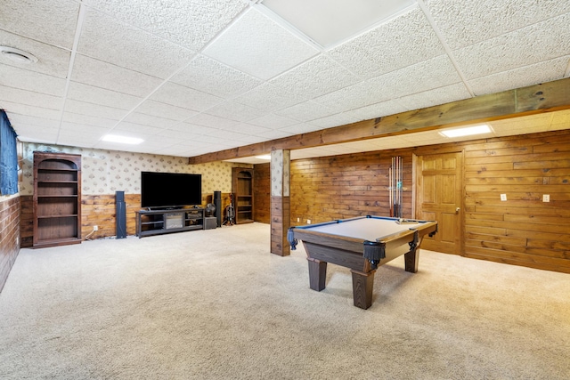 playroom featuring carpet floors, wooden walls, a drop ceiling, and billiards