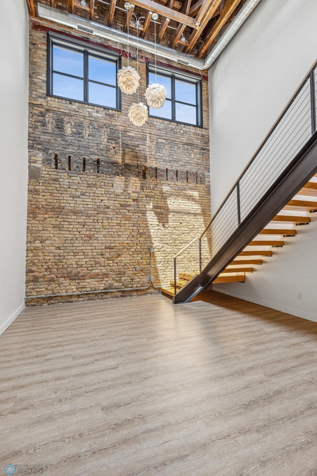 basement with hardwood / wood-style floors