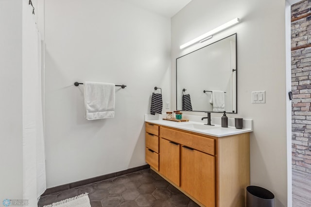 bathroom with tile patterned floors and vanity