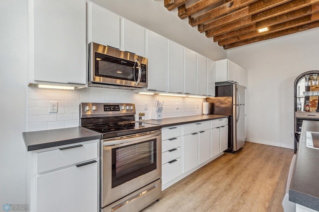 kitchen with white cabinetry and appliances with stainless steel finishes