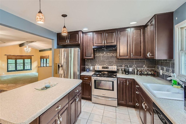 kitchen with sink, decorative light fixtures, dark brown cabinets, and appliances with stainless steel finishes