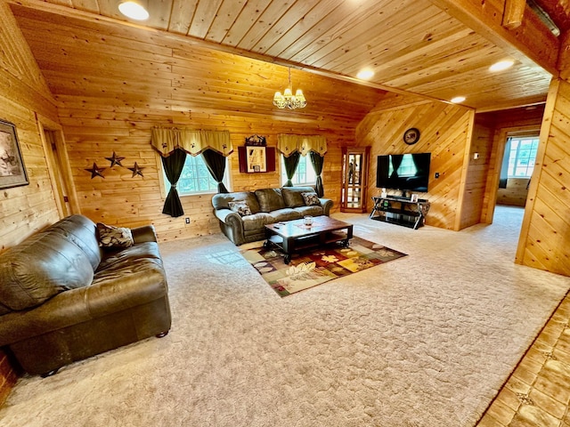 carpeted living room featuring lofted ceiling, wood ceiling, wooden walls, and a healthy amount of sunlight