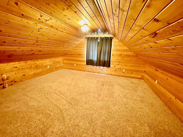 bonus room featuring lofted ceiling, wooden ceiling, wood walls, and carpet