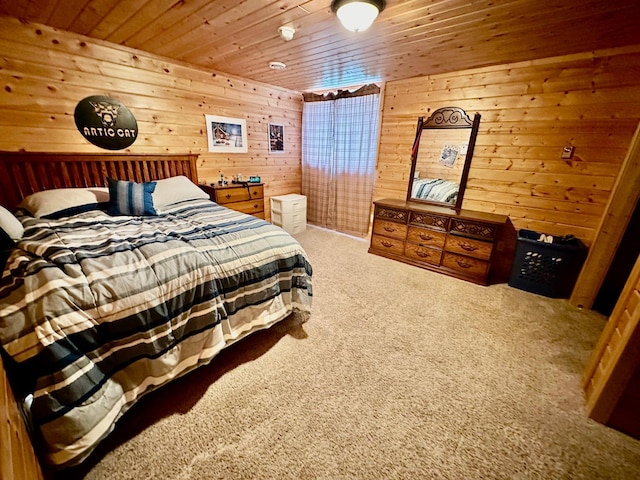 bedroom featuring wood walls, wood ceiling, and carpet flooring