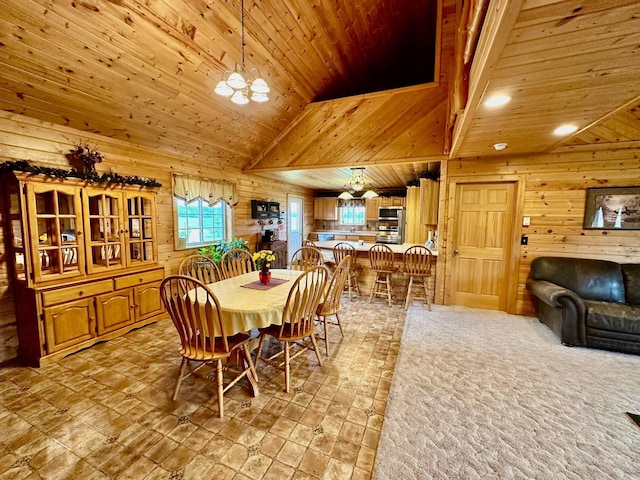 dining space with wood ceiling, wooden walls, and an inviting chandelier