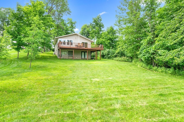 view of yard with a wooden deck