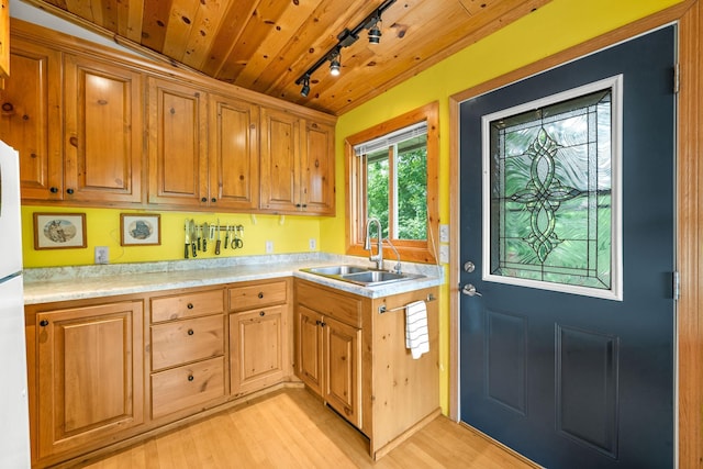 1738 White Ash Dr Unit A, Balsam Lake, WI 54810 - kitchen featuring light wood-style floors, track lighting, wooden ceiling, a sink, and light countertops