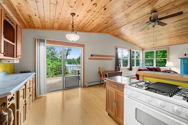1738 White Ash Dr Unit A, Balsam Lake, WI 54810 - kitchen featuring light wood finished floors, baseboard heating, white range with gas cooktop, and a healthy amount of sunlight