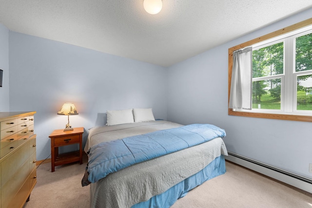 1738 White Ash Dr Unit A, Balsam Lake, WI 54810 - bedroom with light colored carpet, a baseboard heating unit, and a textured ceiling