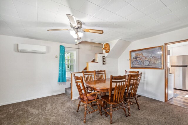 dining space with an AC wall unit, carpet floors, and baseboards