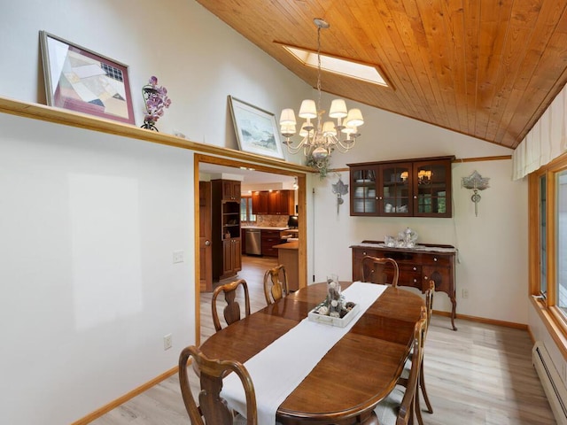 dining room featuring vaulted ceiling, a baseboard heating unit, a notable chandelier, wooden ceiling, and light hardwood / wood-style flooring