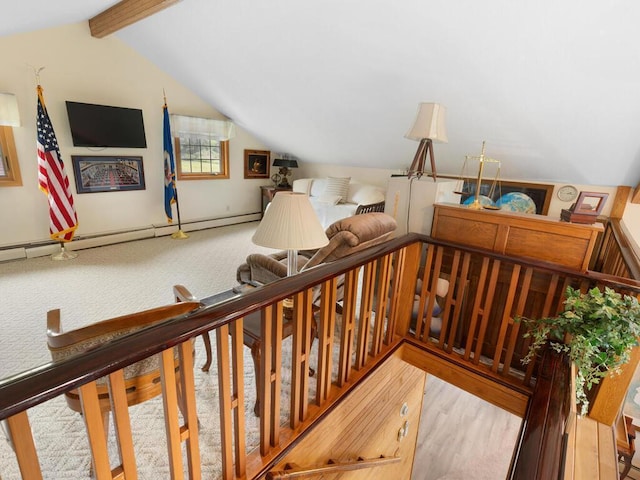 stairway featuring hardwood / wood-style floors, a baseboard radiator, and lofted ceiling with beams