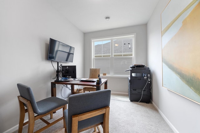 carpeted home office with baseboards