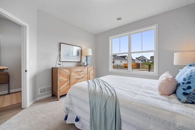 bedroom with light wood-type flooring