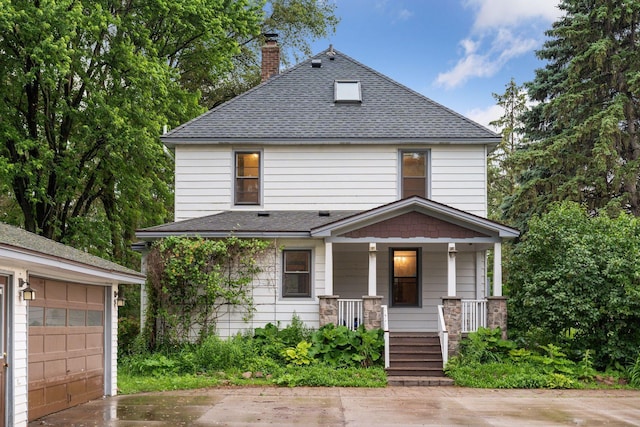 view of front of house featuring a garage and covered porch