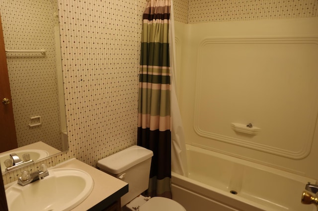 full bathroom featuring vanity, toilet, and shower / bath combo with shower curtain