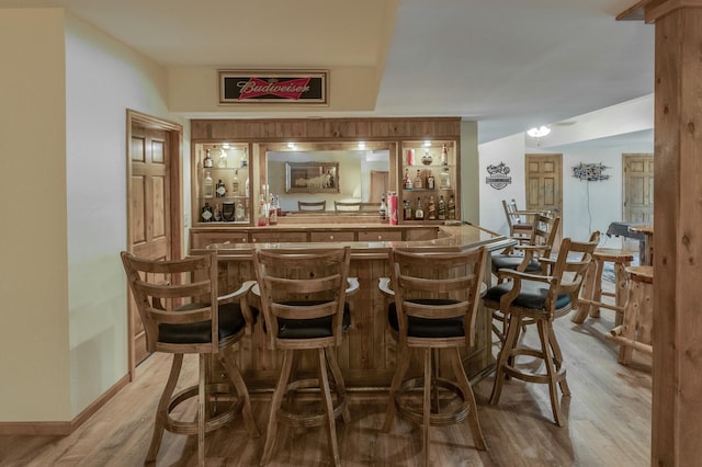 bar featuring light wood-type flooring