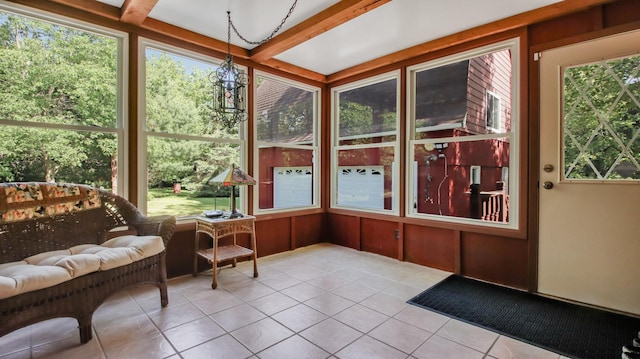 sunroom with beamed ceiling