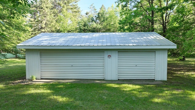 garage with a yard