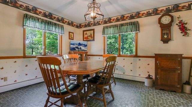 dining space with a baseboard heating unit