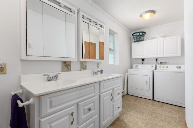 washroom featuring crown molding, light tile flooring, electric dryer hookup, sink, and separate washer and dryer