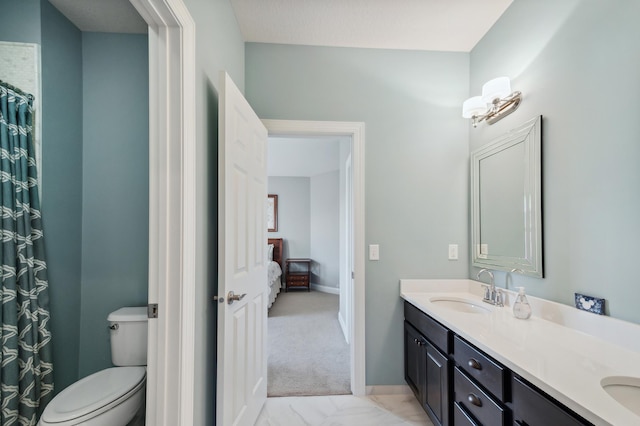 bathroom with vanity and toilet