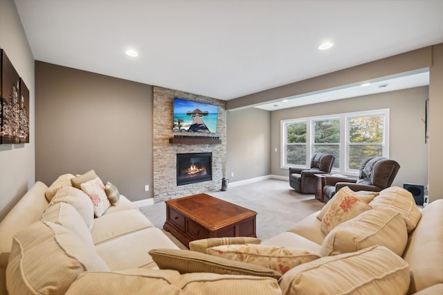 carpeted living room featuring a fireplace