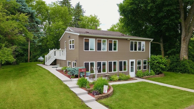 46350 Cambridge Dr, Stanchfield, MN 55080 - rear view of house featuring a lawn