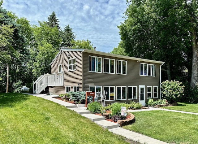 46350 Cambridge Dr, Stanchfield, MN 55080 - rear view of house with a yard, a deck, and stairs