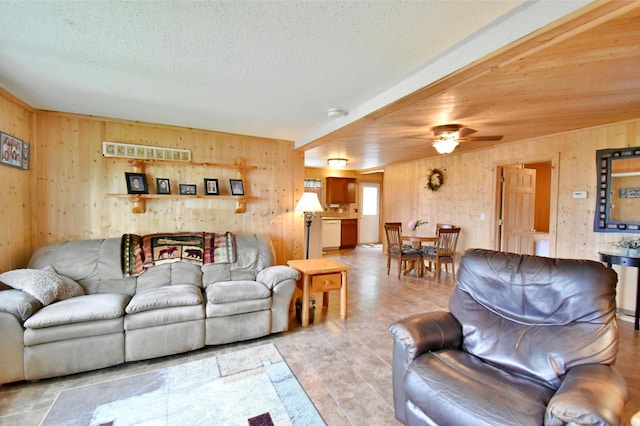 46350 Cambridge Dr, Stanchfield, MN 55080 - living room featuring wooden walls, ceiling fan, and a textured ceiling