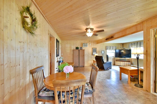 46350 Cambridge Dr, Stanchfield, MN 55080 - dining area featuring a wall mounted AC, wooden ceiling, ceiling fan, and wood walls