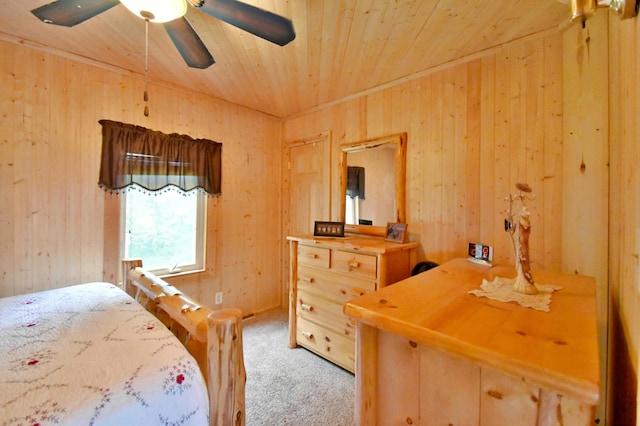46350 Cambridge Dr, Stanchfield, MN 55080 - bedroom featuring carpet flooring, wooden walls, wood ceiling, and a ceiling fan