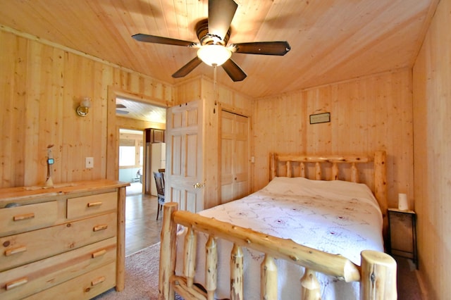 46350 Cambridge Dr, Stanchfield, MN 55080 - bedroom featuring wood walls, wooden ceiling, and a ceiling fan