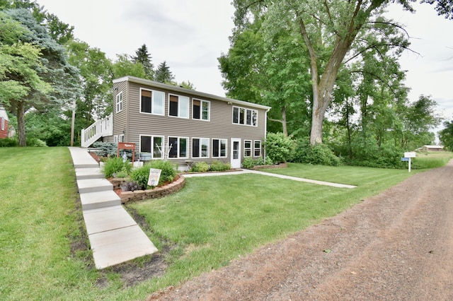 46350 Cambridge Dr, Stanchfield, MN 55080 - colonial home featuring a front lawn